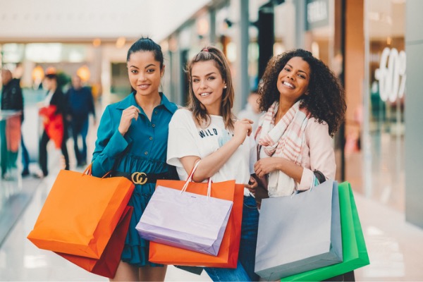 Friends shopping with bags at the mall